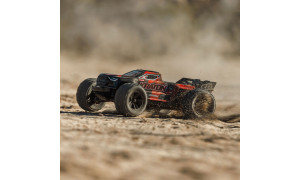 Arrma 1/16 Mini Kraton 3S DSC 4X4 RTR in black and red colours racing across sand with dust cloud, large tyres and Kraton side branding
