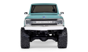 Front view of green SCX30 Chevrolet K10 RC truck with chrome grille, deep-tread tires, and side mirrors