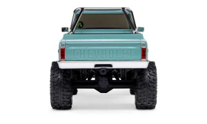 Rear view of green SCX30 Chevrolet K10 RC truck with embossed CHEVROLET tailgate, chrome bumper, and roll cage