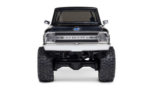 Front view of Axial SCX30 Chevrolet K10 RC truck showing chrome grille, blue bowtie emblem, and rugged tires