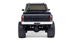 Rear view of SCX30 Chevrolet K10 RC truck with embossed CHEVROLET tailgate, chrome bumper, and roll cage
