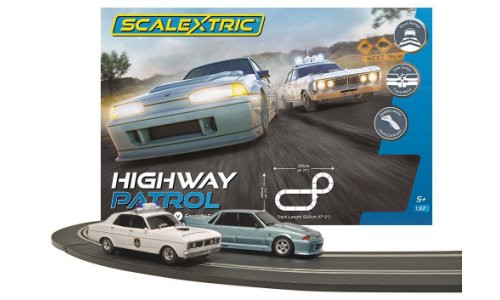 Scalextric C1453SF Highway Patrol slot car set with Ford XY Falcon, Holden VL Commodore, stunt ramps, and crossover track