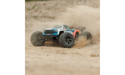 Arrma 1/16 Mini Kraton 3S DSC 4X4 RTR brushless speed truck in red and blue livery kicking up dust with large off-road tyres and aggressive body styling