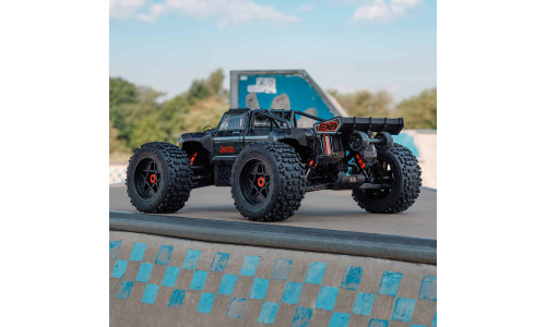 Arrma Outcast EXB 8S – 1/5 scale stunt truck with matte/gloss black body and dBoots Back-Flip tires