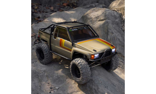 Axial Racing AXI-2062T1 1/10 SCX10 III 1987 Toyota SR5 4X4 RTR brushed rock crawler in tan with detailed scale pickup body