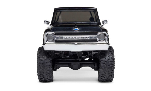 Front view of Axial SCX30 Chevrolet K10 RC truck showing chrome grille, blue bowtie emblem, and rugged tires