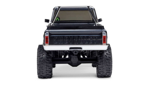 Rear view of SCX30 Chevrolet K10 RC truck with embossed CHEVROLET tailgate, chrome bumper, and roll cage