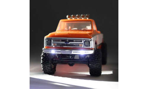 Axial 1/24 SCX24 Chevrolet C10 Orange AXI-3408T2 with classic pickup styling and capable mini crawler performance