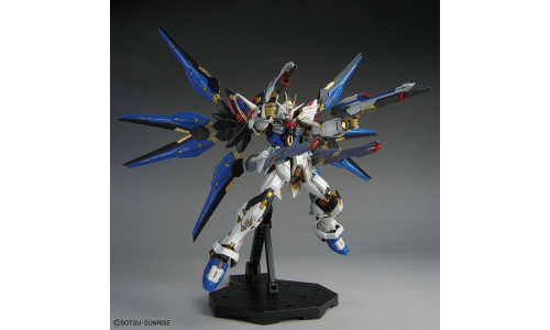 Bandai 1/100 MGEX Strike Freedom Gundam (5063368) featuring high-detail armor, gold frame parts and dynamic proportions