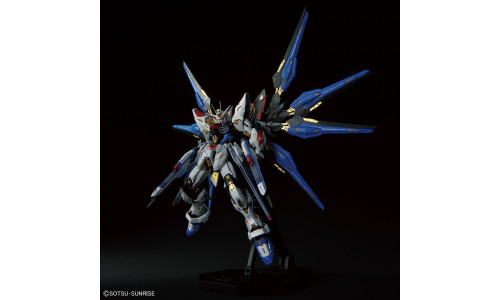 Bandai MGEX Strike Freedom 1/100 scale model kit with detailed wings, weaponry and articulated inner structure
