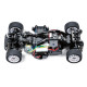 Chassis view of Tamiya 1/10 Mini Cooper ’94 Monte Carlo M-05 showing front-wheel-drive layout, electric motor, battery pack, steering servo, suspension arms, and wiring