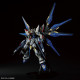 Bandai MGEX Strike Freedom 1/100 scale model kit with detailed wings, weaponry and articulated inner structure